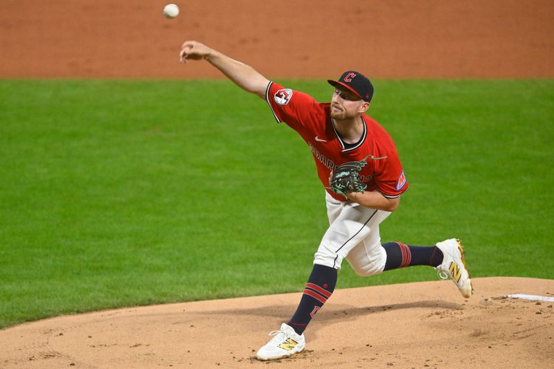 Apr 29, 2025; Cleveland, Ohio, USA; Cleveland Guardians starting pitcher Tanner Bibee (28) delivers a pitch in the first inning against the Minnesota Twins at Progressive Field. Mandatory Credit: David Richard-Imagn Images