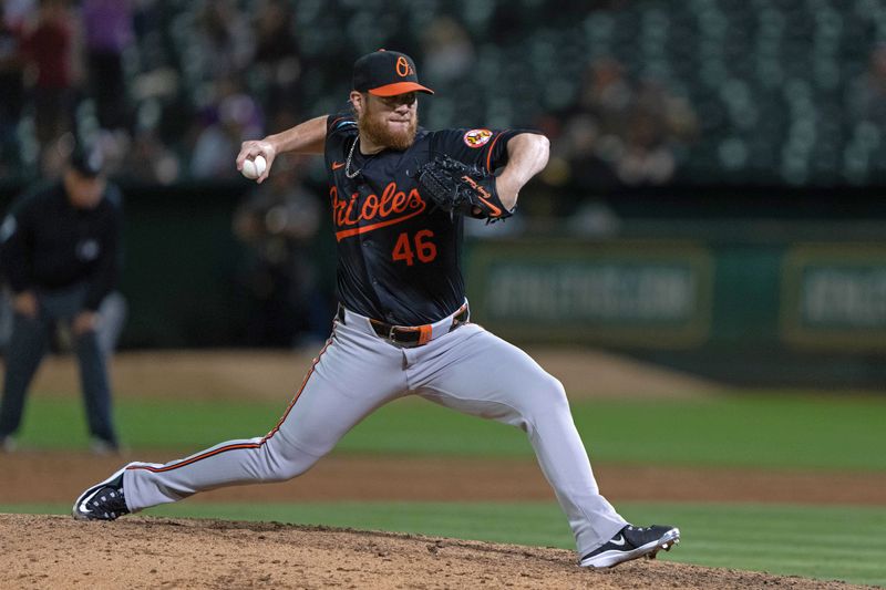Jul 5, 2024; Oakland, California, USA;  Baltimore Orioles pitcher Craig Kimbrel (46) pitches during the ninth inning against the Oakland Athletics at Oakland-Alameda County Coliseum. Mandatory Credit: Stan Szeto-USA TODAY Sports