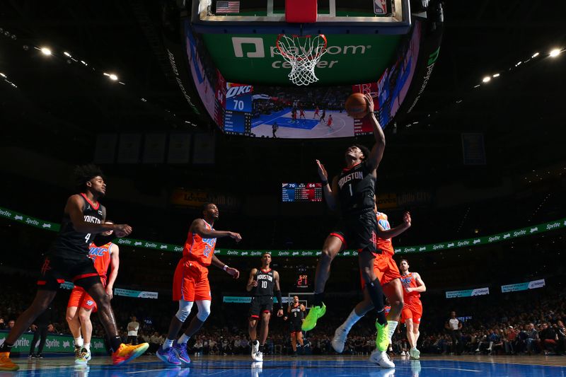 OKLAHOMA CITY, OK - MARCH 27:  Amen Thompson #1 of the Houston Rockets grabs a rebound during the game against the Oklahoma City Thunder on March 27, 2024 at Paycom Arena in Oklahoma City, Oklahoma. NOTE TO USER: User expressly acknowledges and agrees that, by downloading and or using this photograph, User is consenting to the terms and conditions of the Getty Images License Agreement. Mandatory Copyright Notice: Copyright 2024 NBAE (Photo by Zach Beeker/NBAE via Getty Images)