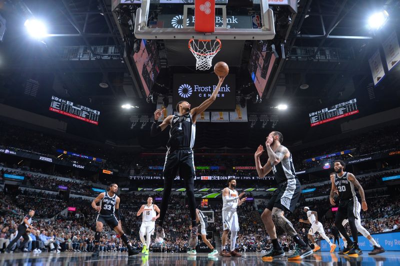 SAN ANTONIO, TX - APRIL 12:  Victor Wembanyama #1 of the San Antonio Spurs grabs the rebound during the game on April 12, 2024 at the Frost Bank Center in San Antonio, Texas. NOTE TO USER: User expressly acknowledges and agrees that, by downloading and or using this photograph, user is consenting to the terms and conditions of the Getty Images License Agreement. Mandatory Copyright Notice: Copyright 2024 NBAE (Photos by Michael Gonzales/NBAE via Getty Images)