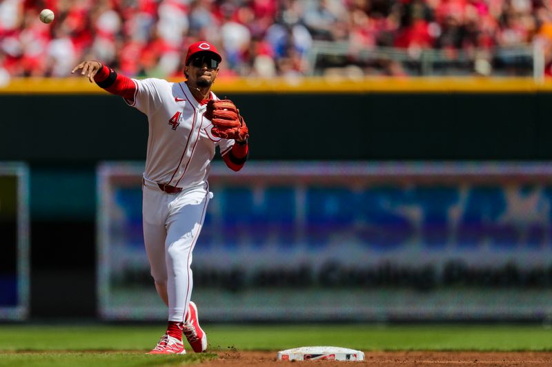 Apr 7, 2024; Cincinnati, Ohio, USA; Cincinnati Reds second baseman Santiago Espinal (4) throws to first to get New York Mets shortstop Francisco Lindor (not pictured) out in the second inning at Great American Ball Park. Mandatory Credit: Katie Stratman-USA TODAY Sports