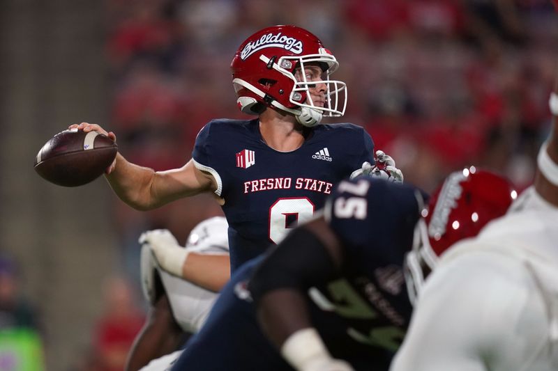 Sep 24, 2021; Fresno, California, USA; Fresno State Bulldogs quarterback Jake Haener (9) throws a pass against the UNLV Rebels in the second quarter at Bulldog Stadium. Mandatory Credit: Cary Edmondson-USA TODAY Sports