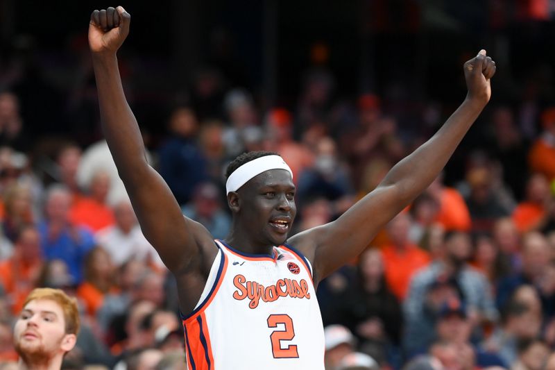 Dec 10, 2022; Syracuse, New York, USA; Syracuse Orange forward John Bol Ajak (2) celebrates from the sidelines against the Georgetown Hoyas during the second half at the JMA Wireless Dome. Mandatory Credit: Rich Barnes-USA TODAY Sports