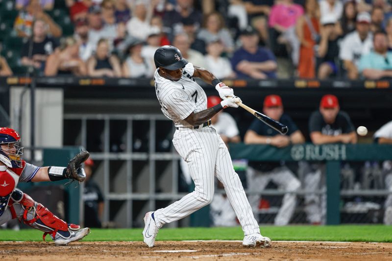 Jul 4, 2023; Chicago, Illinois, USA; Chicago White Sox shortstop Tim Anderson (7) singles against the Toronto Blue Jays during the sixth inning at Guaranteed Rate Field. Mandatory Credit: Kamil Krzaczynski-USA TODAY Sports