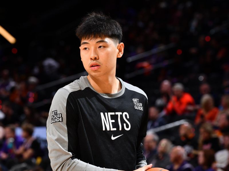 PHOENIX, AZ - NOVEMBER 27: Cui Yongxi #8 of the Brooklyn Nets warms up before the game against the Phoenix Suns on November 27, 2024 at Footprint Center in Phoenix, Arizona. NOTE TO USER: User expressly acknowledges and agrees that, by downloading and or using this photograph, user is consenting to the terms and conditions of the Getty Images License Agreement. Mandatory Copyright Notice: Copyright 2024 NBAE (Photo by Barry Gossage/NBAE via Getty Images)