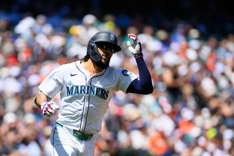Jul 4, 2024; Seattle, Washington, USA; Seattle Mariners shortstop J.P. Crawford (3) runs towards first base after hitting a single against the Baltimore Orioles during the first inning at T-Mobile Park. Mandatory Credit: Steven Bisig-USA TODAY Sports
