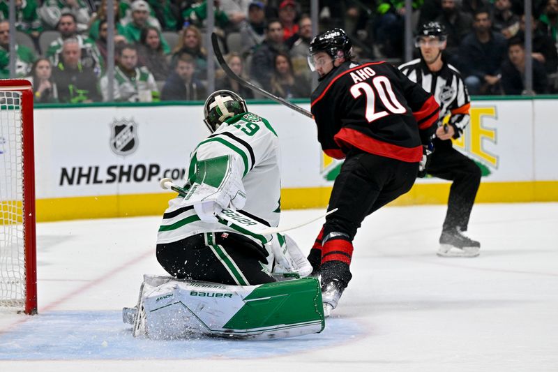 Jan 25, 2023; Dallas, Texas, USA; Carolina Hurricanes center Sebastian Aho (20) scores a shorthanded goal against Dallas Stars goaltender Jake Oettinger (29) during the first period at the American Airlines Center. Mandatory Credit: Jerome Miron-USA TODAY Sports