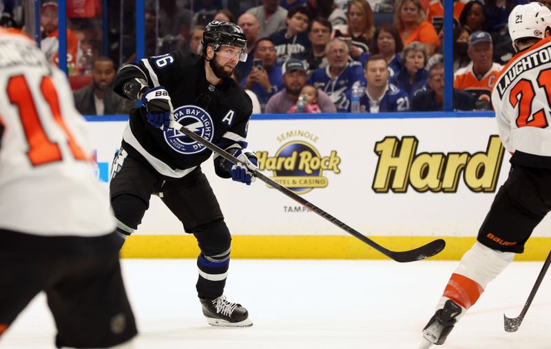 Mar 9, 2024; Tampa, Florida, USA; Tampa Bay Lightning right wing Nikita Kucherov (86) passes the puck against the Philadelphia Flyers during the first period at Amalie Arena. Mandatory Credit: Kim Klement Neitzel-USA TODAY Sports