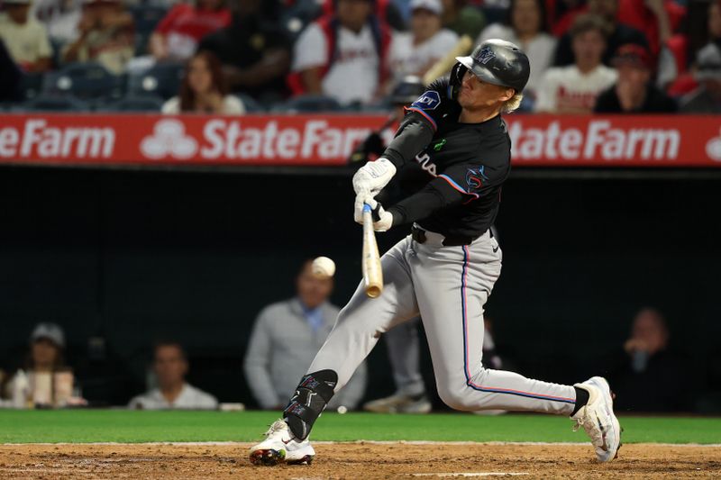 May 23, 2025; Anaheim, California, USA;  Miami Marlins left fielder Kyle Stowers (28) hits a single during the sixth inning against the Los Angeles Angels at Angel Stadium. Mandatory Credit: Kiyoshi Mio-Imagn Images