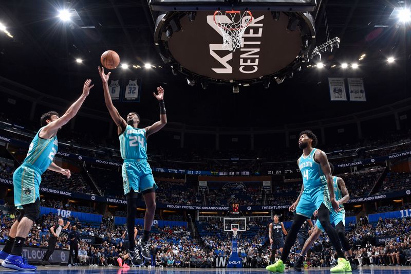 ORLANDO, FL - MARCH 19: Brandon Miller #24 of the Charlotte Hornets rebounds during the game against the Orlando Magic on March 19, 2024 at the Kia Center in Orlando, Florida. NOTE TO USER: User expressly acknowledges and agrees that, by downloading and or using this photograph, User is consenting to the terms and conditions of the Getty Images License Agreement. Mandatory Copyright Notice: Copyright 2024 NBAE (Photo by Fernando Medina/NBAE via Getty Images)