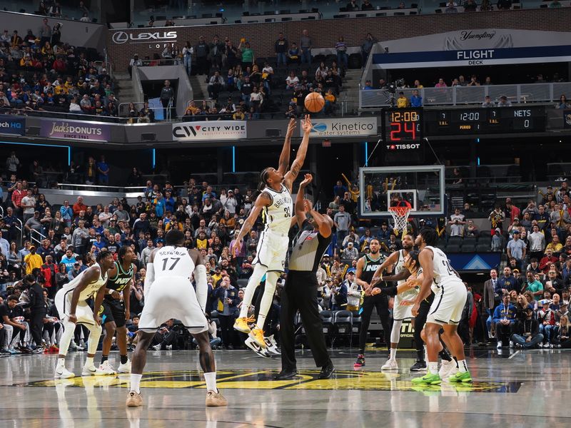 INDIANAPOLIS, IN - MARCH 16: Nicolas Claxton #33 of the Brooklyn Nets goes up for the opening tip off on March 16, 2024 at Gainbridge Fieldhouse in Indianapolis, Indiana. NOTE TO USER: User expressly acknowledges and agrees that, by downloading and or using this Photograph, user is consenting to the terms and conditions of the Getty Images License Agreement. Mandatory Copyright Notice: Copyright 2024 NBAE (Photo by Ron Hoskins/NBAE via Getty Images)