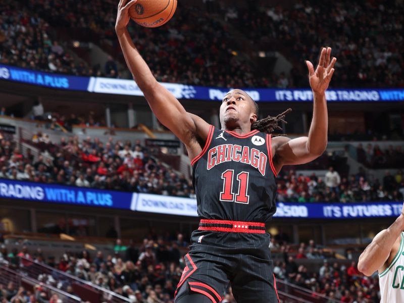 CHICAGO, IL - NOVEMBER 29: Ayo Dosunmu #11 of the Chicago Bulls drives to the basket during the game against the Boston Celtics during the Emirates NBA Cup game on November 29, 2024 at United Center in Chicago, Illinois. NOTE TO USER: User expressly acknowledges and agrees that, by downloading and or using this photograph, User is consenting to the terms and conditions of the Getty Images License Agreement. Mandatory Copyright Notice: Copyright 2024 NBAE (Photo by Jeff Haynes/NBAE via Getty Images)