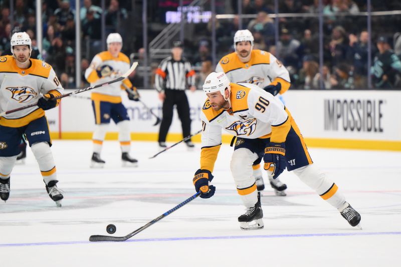 Nov 2, 2023; Seattle, Washington, USA; Nashville Predators center Ryan O'Reilly (90) plays the puck against the Seattle Kraken during the third period at Climate Pledge Arena. Mandatory Credit: Steven Bisig-USA TODAY Sports