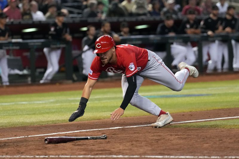 Aug 26, 2023; Phoenix, Arizona, USA; Cincinnati Reds pinch runner Michael Siani (38) slides and scores a run against the Arizona Diamondbacks during the ninth inning at Chase Field. Mandatory Credit: Joe Camporeale-USA TODAY Sports