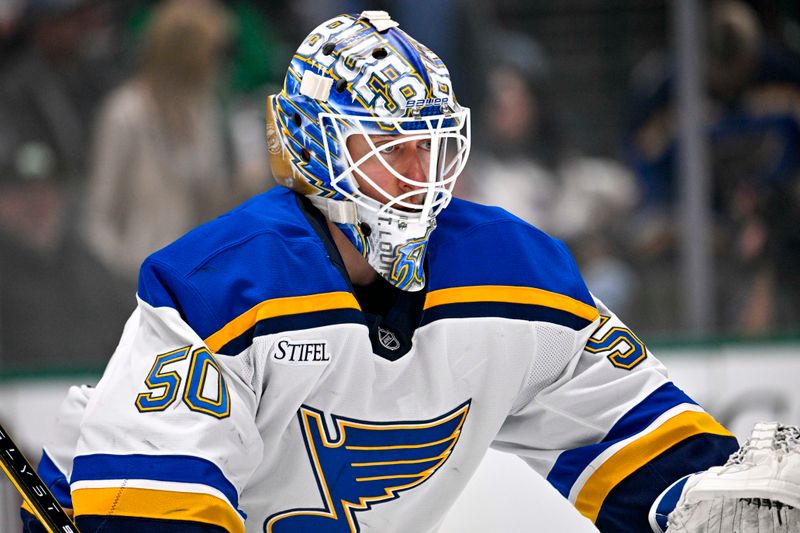 Dec 14, 2024; Dallas, Texas, USA; St. Louis Blues goaltender Jordan Binnington (50) faces the Dallas Stars attack during the second period at American Airlines Center. Mandatory Credit: Jerome Miron-Imagn Images