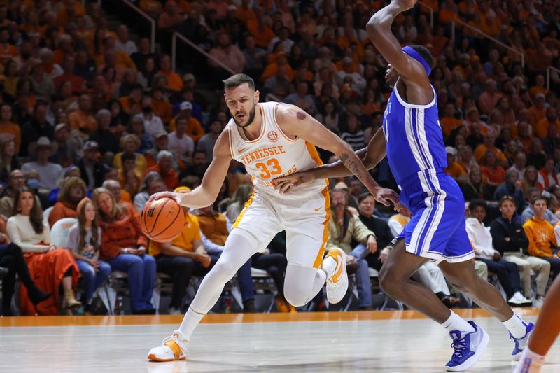 Jan 14, 2023; Knoxville, Tennessee, USA; Tennessee Volunteers forward Uros Plavsic (33) moves the ball against the Kentucky Wildcats during the first half at Thompson-Boling Arena. Mandatory Credit: Randy Sartin-USA TODAY Sports