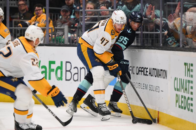 Mar 16, 2024; Seattle, Washington, USA; Nashville Predators right wing Michael McCarron (47) and Seattle Kraken left wing Andre Burakovsky (95) play the puck during the second period at Climate Pledge Arena. Mandatory Credit: Steven Bisig-USA TODAY Sports