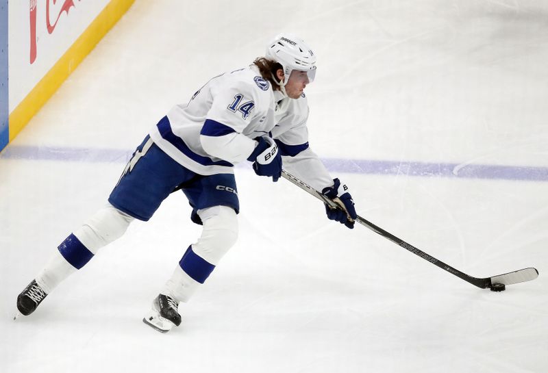 Nov 19, 2024; Pittsburgh, Pennsylvania, USA; Tampa Bay Lightning center Conor Geekie (14) skates with the puck against the Pittsburgh Penguins during the second period at PPG Paints Arena. Mandatory Credit: Charles LeClaire-Imagn Images