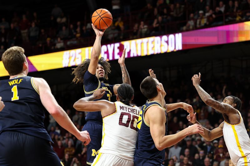 Jan 16, 2025; Minneapolis, Minnesota, USA; Michigan Wolverines guard Tre Donaldson (3) shoots against the Minnesota Golden Gophers during overtime at Williams Arena. Mandatory Credit: Matt Krohn-Imagn Images