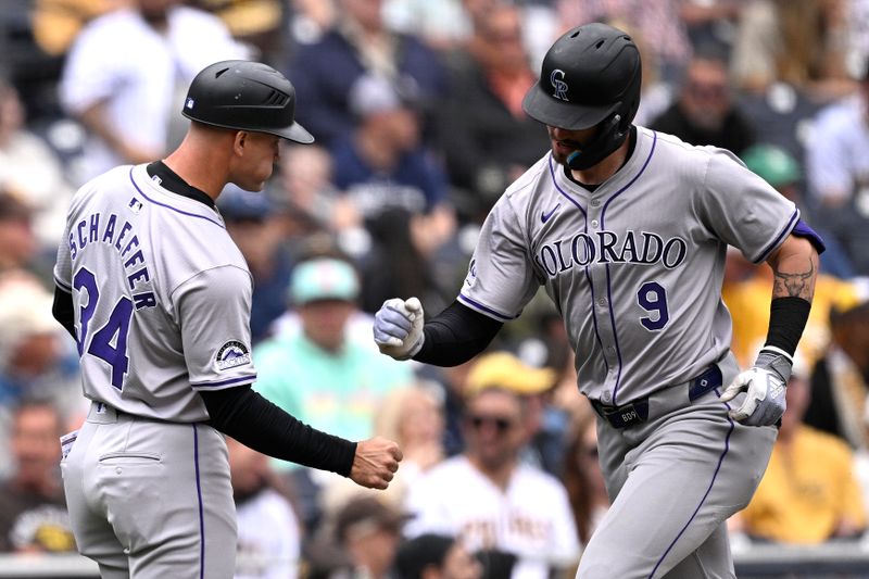 May 15, 2024; San Diego, California, USA; Colorado Rockies center fielder Brenton Doyle (9) is congratulated by third base coach Warren Schaeffer (34) while rounding the bases after hitting a home run against the San Diego Padres during the second inning at Petco Park. Mandatory Credit: Orlando Ramirez-USA TODAY Sports