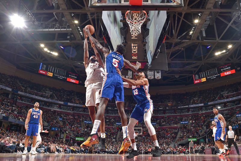 CLEVELAND, OH - MARCH 29: Mo Bamba #5 of the Philadelphia 76ers block during the game against the Cleveland Cavaliers on March 29, 2024 at Rocket Mortgage FieldHouse in Cleveland, Ohio. NOTE TO USER: User expressly acknowledges and agrees that, by downloading and/or using this Photograph, user is consenting to the terms and conditions of the Getty Images License Agreement. Mandatory Copyright Notice: Copyright 2024 NBAE (Photo by David Liam Kyle/NBAE via Getty Images)