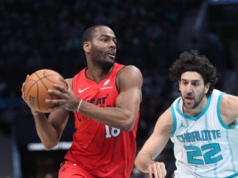 CHARLOTTE, NC - NOVEMBER 27:  Alec Burks #18 of the Miami Heat handles the ball during the game against the Charlotte Hornets on November 27, 2024 at Spectrum Center in Charlotte, North Carolina. NOTE TO USER: User expressly acknowledges and agrees that, by downloading and or using this photograph, User is consenting to the terms and conditions of the Getty Images License Agreement. Mandatory Copyright Notice: Copyright 2024 NBAE (Photo by Brock Williams-Smith/NBAE via Getty Images)