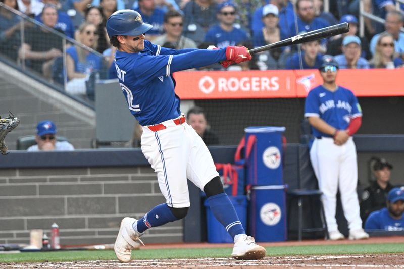 Sep 28, 2025; Toronto, Ontario, CAN;  Toronto Blue Jays shortstop Ernie Clement (22) hits a single against the Tampa Bay Rays in the fourth inning at Rogers Centre. Mandatory Credit: Dan Hamilton-Imagn Images