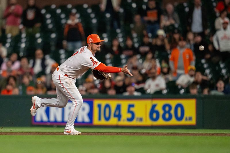 Aug 29, 2023; San Francisco, California, USA;  San Francisco Giants first baseman J.D. Davis (7) throws out Cincinnati Reds designated hitter Nick Martini (not pictured) during the seventh inning at Oracle Park. Mandatory Credit: Neville E. Guard-USA TODAY Sports