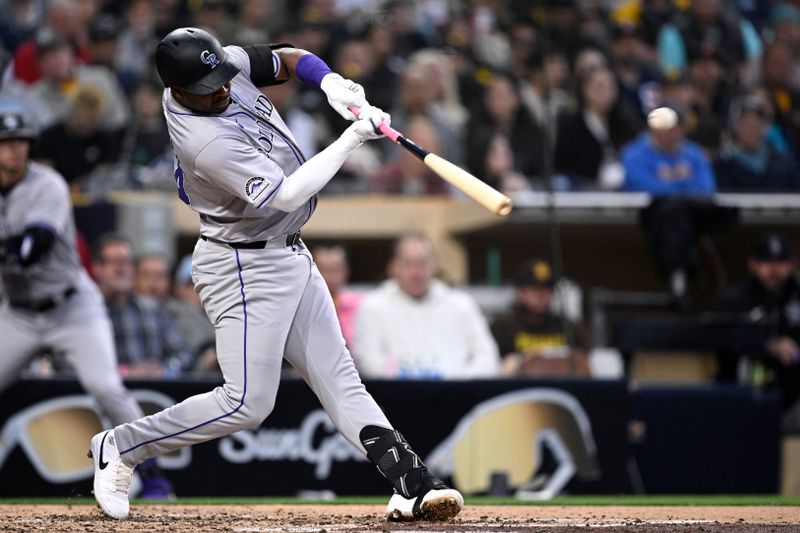 May 13, 2024; San Diego, California, USA; Colorado Rockies first baseman Elehuris Montero (44) hits a two-RBI double during the fourth inning against the San Diego Padres at Petco Park. Mandatory Credit: Orlando Ramirez-USA TODAY Sports