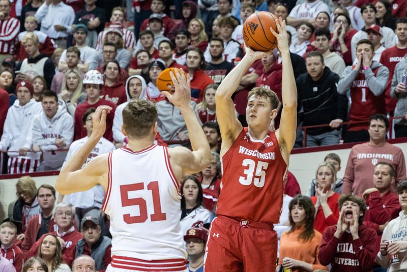 Jan 14, 2023; Bloomington, Indiana, USA; Wisconsin Badgers forward Markus Ilver (35) shoots the ball while Indiana Hoosiers center Logan Duncomb (51) defends in the second half at Simon Skjodt Assembly Hall. Mandatory Credit: Trevor Ruszkowski-USA TODAY Sports