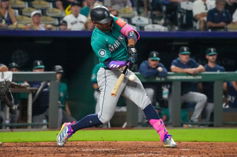 Sep 17, 2025; Kansas City, Missouri, USA; Seattle Mariners center fielder Julio Rodriguez (44) hits a single against the Kansas City Royals during the eighth inning at Kauffman Stadium. Mandatory Credit: Denny Medley-Imagn Images