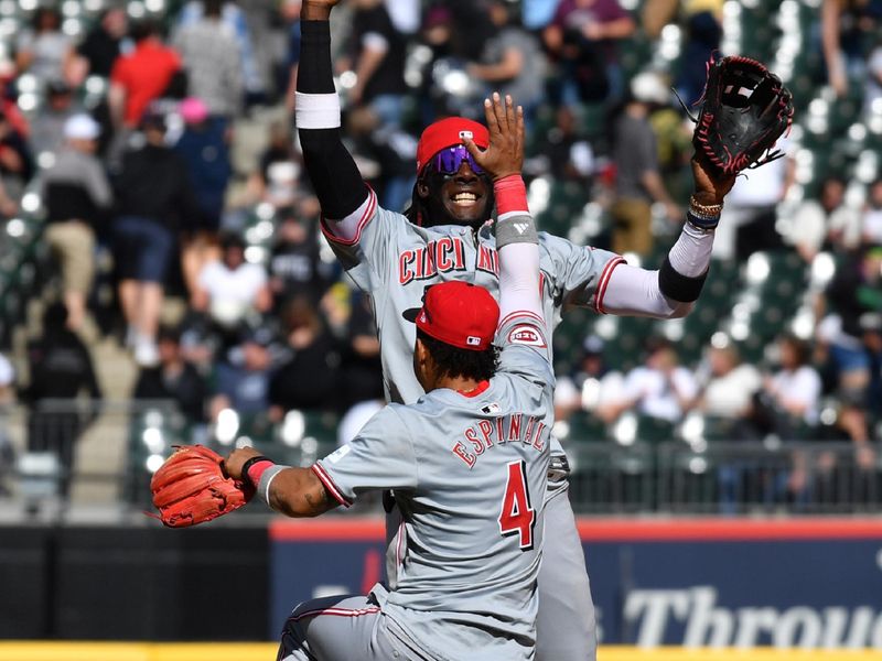 Apr 13, 2024; Chicago, Illinois, USA; Cincinnati Reds shortstop Elly De La Cruz (44) celebrates with second baseman Santiago Espinal (4) after defeating the Chicago White Sox at Guaranteed Rate Field. Mandatory Credit: Patrick Gorski-USA TODAY Sports