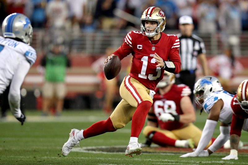 San Francisco 49ers quarterback Brock Purdy (13) scrambles during the NFC Championship NFL football game against the Detroit Lions in Santa Clara, Calif., Sunday, Jan. 28, 2024. (AP Photo/Scot Tucker)