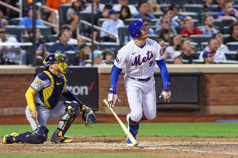 Jun 27, 2023; New York City, New York, USA; New York Mets center fielder Brandon Nimmo (9) hits a two run home run during the fifth inning against the Milwaukee Brewers  at Citi Field. Mandatory Credit: Vincent Carchietta-USA TODAY Sports