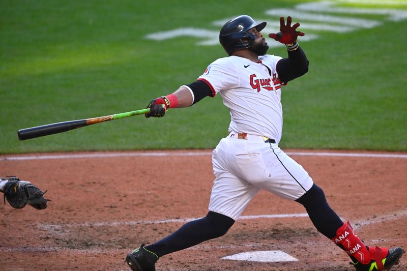 May 31, 2025; Cleveland, Ohio, USA; Cleveland Guardians first baseman Carlos Santana (41) hits a solo home run in the seventh inning against the Los Angeles Angels at Progressive Field. Mandatory Credit: David Richard-Imagn Images