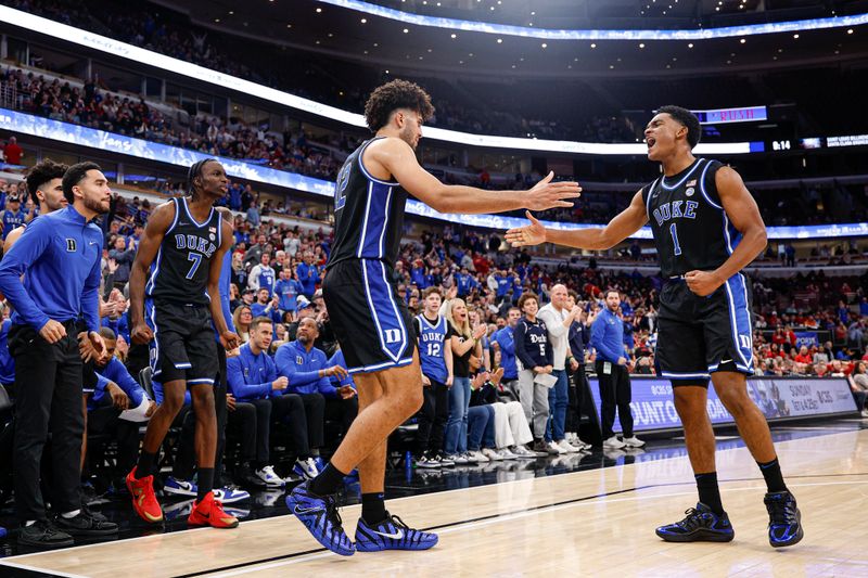 Nov 27, 2025; Chicago, Illinois, USA; Duke Blue Devils forward Cameron Boozer (12) celebrates with guard Caleb Foster (1) during the second half at United Center. Mandatory Credit: Kamil Krzaczynski-Imagn Images