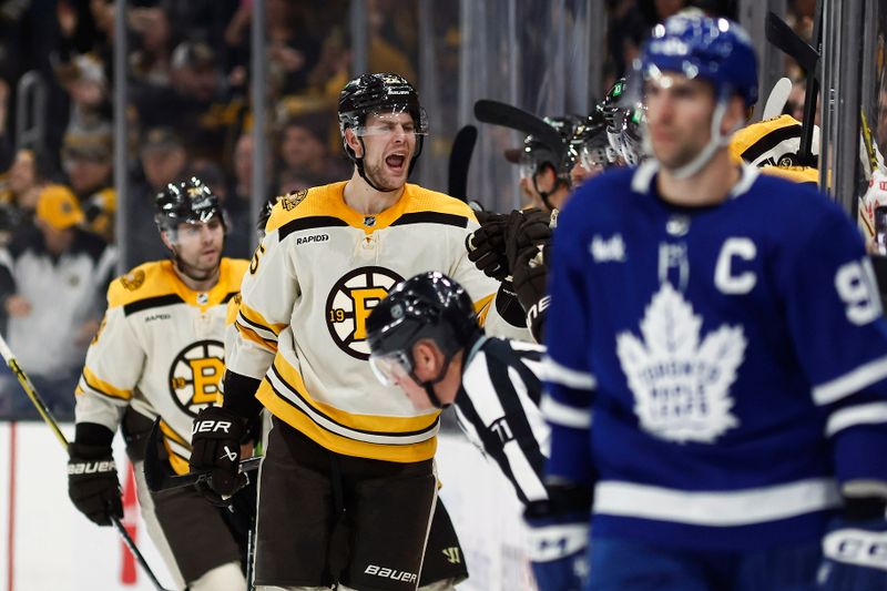 Mar 7, 2024; Boston, Massachusetts, USA; Boston Bruins defenseman Brandon Carlo (25) celebrates his goal with teammates at the bench during the second period against the Toronto Maple Leafs at TD Garden. Mandatory Credit: Winslow Townson-USA TODAY Sports