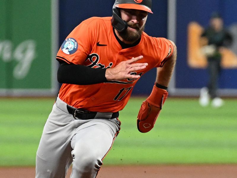 Aug 10, 2024; St. Petersburg, Florida, USA; Baltimore Orioles left fielder Colt Cowser (17) heads for third base on his way to scoring a run in the first inning against the Tampa Bay Rays at Tropicana Field. Mandatory Credit: Jonathan Dyer-USA TODAY Sports