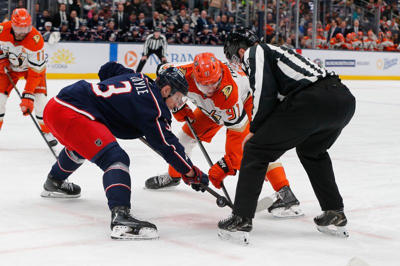 Dec 16, 2025; Columbus, Ohio, USA; Columbus Blue Jackets center Charlie Coyle (3) and Anaheim Ducks center Leo Carlsson (91) face-off during the first period at Nationwide Arena. Mandatory Credit: Russell LaBounty-Imagn Images