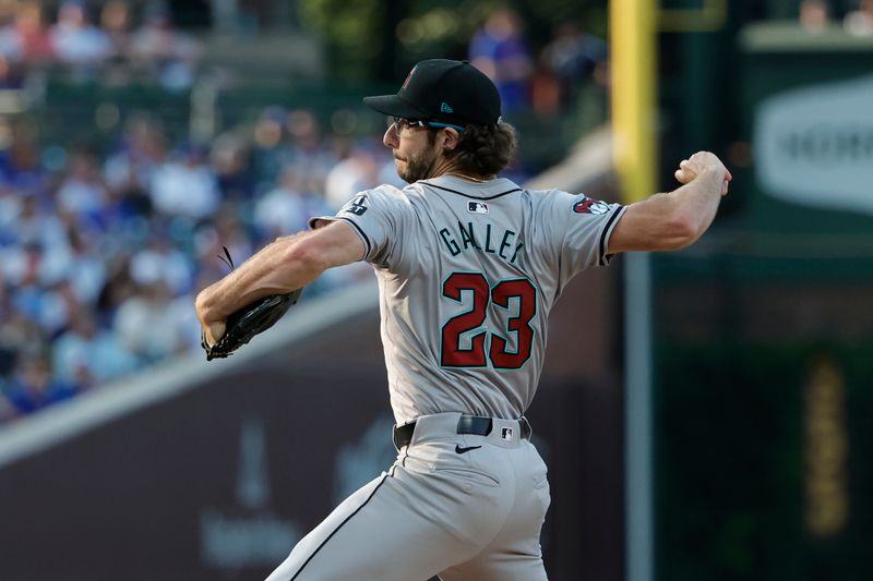 Jul 20, 2024; Chicago, Illinois, USA; Arizona Diamondbacks starting pitcher Zac Gallen (23) delivers against the Chicago Cubs during the first inning at Wrigley Field. Mandatory Credit: Kamil Krzaczynski-USA TODAY Sports