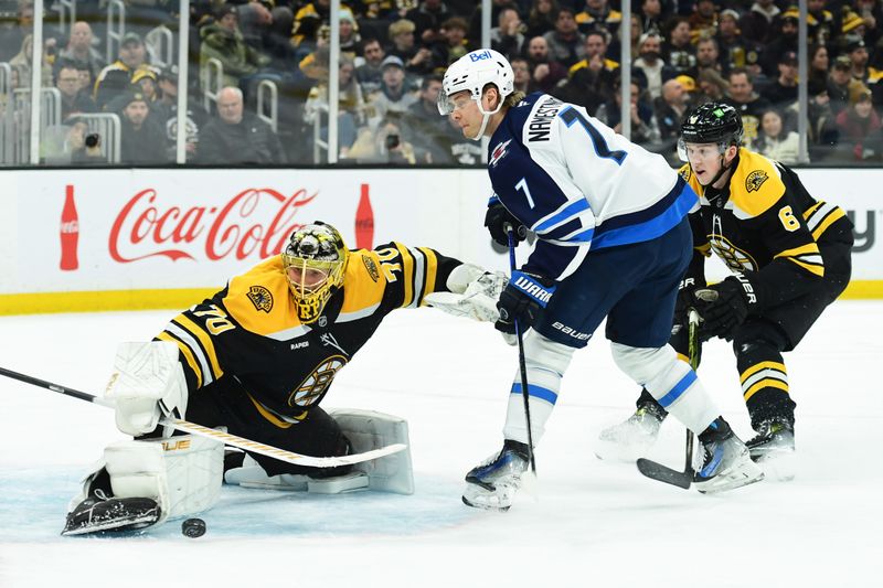 Jan 30, 2025; Boston, Massachusetts, USA; Boston Bruins goaltender Joonas Korpisalo (70) makes a save on Winnipeg Jets center Vladislav Namestnikov (7) during the second period at TD Garden. Mandatory Credit: Bob DeChiara-Imagn Images