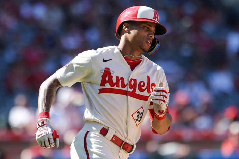 Sep 10, 2023; Anaheim, California, USA; Los Angeles Angels center fielder Jordyn Adams (39) runs after hitting a single against the Cleveland Guardians during the eighth inning at Angel Stadium. Mandatory Credit: Jessica Alcheh-USA TODAY Sports