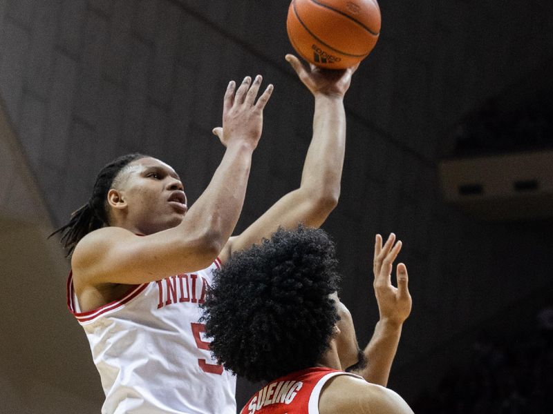 Jan 28, 2023; Bloomington, Indiana, USA; Indiana Hoosiers forward Malik Reneau (5) shoots the ball while Ohio State Buckeyes forward Justice Sueing (14) defends in the first half at Simon Skjodt Assembly Hall. Mandatory Credit: Trevor Ruszkowski-USA TODAY Sports