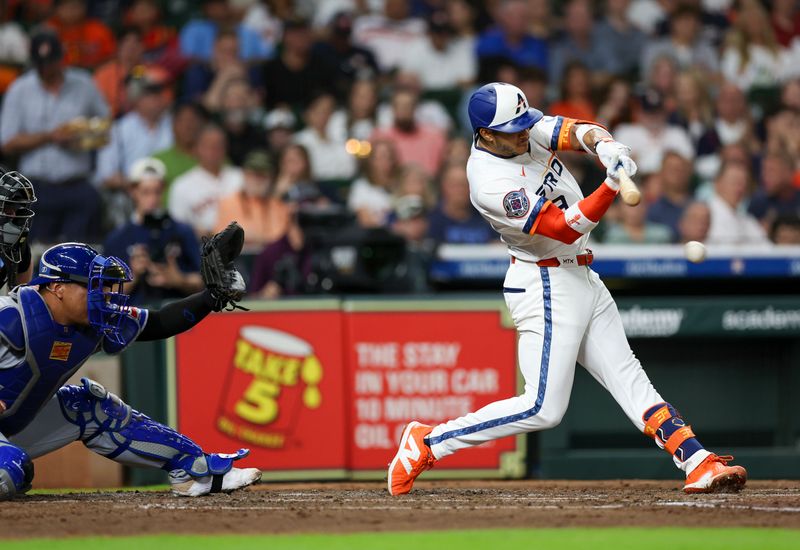 May 12, 2025; Houston, Texas, USA; Houston Astros shortstop Jeremy Pena (3) hits a single against the Kansas City Royals  in the third inning at Daikin Park. Mandatory Credit: Thomas Shea-Imagn Images