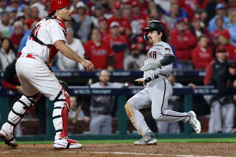 Oct 24, 2023; Philadelphia, Pennsylvania, USA; Arizona Diamondbacks left fielder Corbin Carroll (7) slides in front of Philadelphia Phillies catcher J.T. Realmuto (10) in the fifth inning for game seven of the NLCS for the 2023 MLB playoffs at Citizens Bank Park. Mandatory Credit: Bill Streicher-USA TODAY Sports