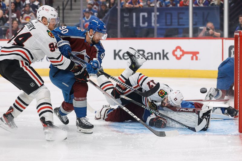 Oct 19, 2023; Denver, Colorado, USA; Colorado Avalanche goaltender Alexandar Georgiev (40) makes a save against Chicago Blackhawks left wing Nick Foligno (17) as left wing Tomas Tatar (90) and right wing Corey Perry (94) defend in the first period at Ball Arena. Mandatory Credit: Isaiah J. Downing-USA TODAY Sports