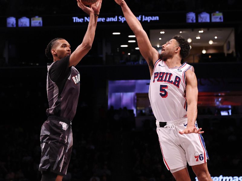 NEW YORK, NEW YORK - FEBRUARY 12:  Ziaire Williams #8 of the Brooklyn Nets shoots against Andre Drummond #5 of the Philadelphia 76ers during their game at Barclays Center on February 12, 2025 in New York City. User expressly acknowledges and agrees that, by downloading and or using this photograph, User is consenting to the terms and conditions of the Getty Images License Agreement.   (Photo by Al Bello/Getty Images)