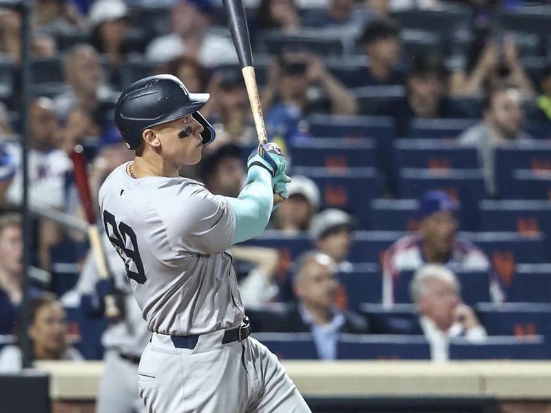 Jun 26, 2024; New York City, New York, USA;  New York Yankees center fielder Aaron Judge (99) hits a two run home run in the sixth inning against the New York Mets at Citi Field. Mandatory Credit: Wendell Cruz-USA TODAY Sports