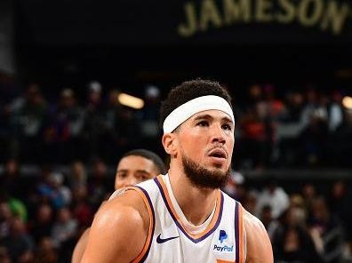 PHOENIX, AZ -DECEMBER 13: Devin Booker #1 of the Phoenix Suns shoots a free throw during the game against the Brooklyn Nets on December 13, 2023 at Footprint Center in Phoenix, Arizona. NOTE TO USER: User expressly acknowledges and agrees that, by downloading and or using this photograph, user is consenting to the terms and conditions of the Getty Images License Agreement. Mandatory Copyright Notice: Copyright 2023 NBAE (Photo by Kate Frese/NBAE via Getty Images)