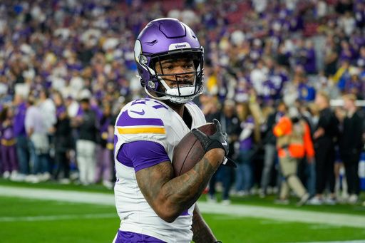 Minnesota Vikings running back Cam Akers (27) before the NFL football game against the Los Angeles Rams, Monday, Jan. 13, 2025, in Glendale, Ariz.. (AP Photo/Samantha Chow)